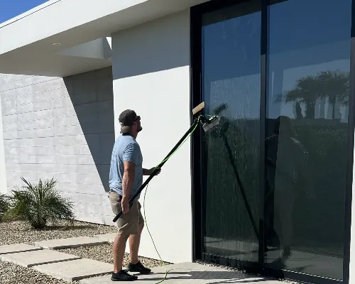 Alex from Glow Window Cleaning hard at work.